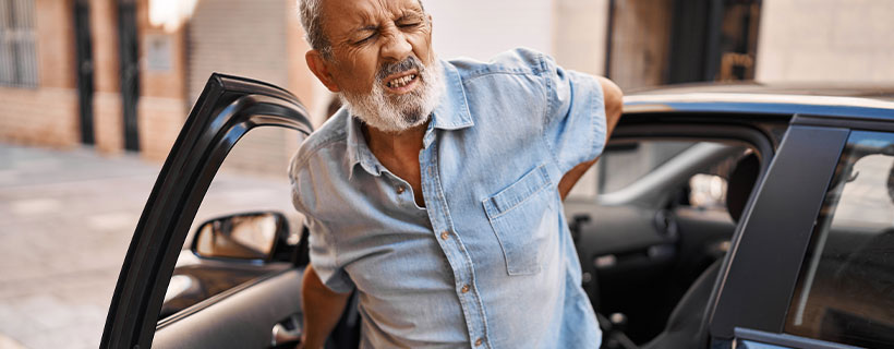 patient with back pain in need of auto accident injury care in Anchorage