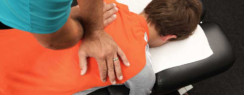 patient receiving drop table chiropractic in Anchorage for auto accident injury pain relief
